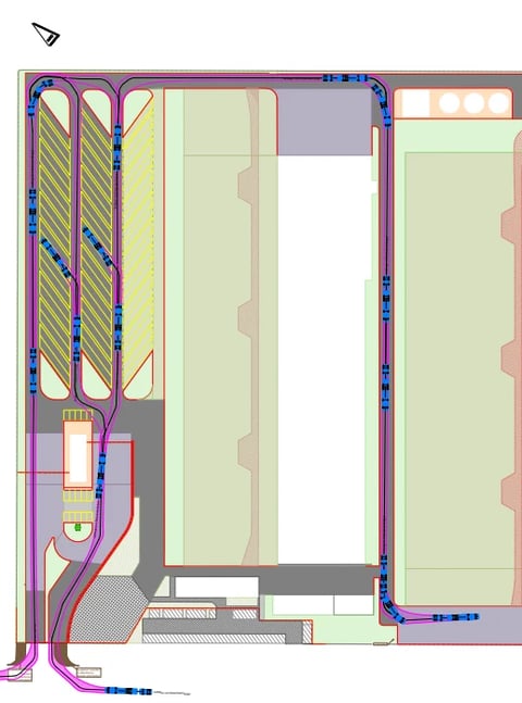 Architectural floor plan with HVAC system layout showing ductwork, supply lines in blue and red, and room spaces in cream and green.